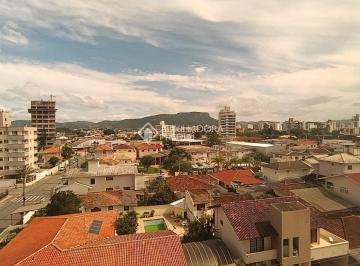 Apartamento · 64m² · 2 Quartos · 2 Vagas · Apartamento duplex à venda com 2 dormitórios no Centro de Palhoça/SC | Com churrasqueira, 2 vagas e 