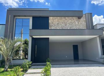 Fachada de Casa Térrea à venda no Condomínio Jardim Piemonte em Indaiatuba com pele de vidro e paisagismo · CONDOMINIO RESIDENCIAL JARDIM PIEMONTE - Casa Térrea Jd. Piemonte: 3 Suítes e Piscina