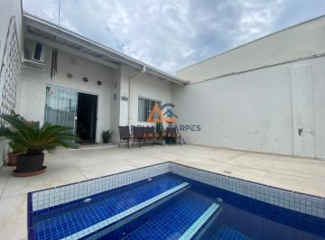 Entrada e piscina · Casa geminada de 3 dormitórios, sendo 1 suíte master, com escritório e 2 vagas de garagem, localizad