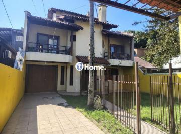 Casa · 280m² · 4 Quartos · 4 Vagas · Casa de 4 dormitórios, 1 suíte e 4 vagas de garagem no bairro Cavalhada.