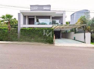 a1cf99cc-d905-4b5e-9fd6-ee59575bd0a7-17763594144227.jpg · Casa em condomínio no Rio Tavares com 5 suítes, piscina e área gourmet. Sofisticação e contato com a