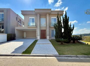 Foto 01 · Casa de luxo em condomínio Alphaville com 4 suítes, 3 salas e 6 vagas de garagem em Santana de Parna