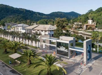 Foto 01 · Venda de Casa em condomínio marina no Guarujá com 881m², 4 suítes, 2 salas amplas, píer para barco c