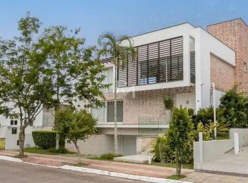 5da6e93c-cfe6-4a52-a833-9f53c5fa1881-1776879182000.jpg · Casa em condomínio com 4 quartos, piscina e 450m² na Lagoa da Conceição, Florianópolis.