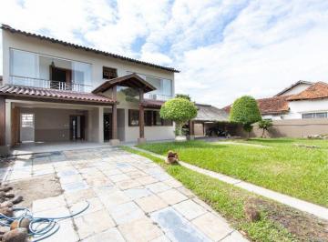 Casa · 257m² · 4 Quartos · 4 Vagas · Casa de 4 dormitórios com piscina para locação no bairro Guarujá