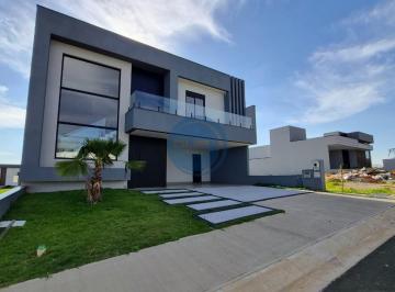 Fachada Moderna · Casa em condomínio: 4 quartos, 4 suítes, 2 salas, 5 banheiros, 4 vagas de garagem, 296m² em Indaiatu