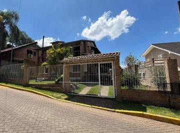 Casa · 190m² · 4 Quartos · 3 Vagas · Residência de Luxo no Cantegril com 4 Dormitórios, 2 Suítes, Piscina e Espaço Gourmet Exclusivo