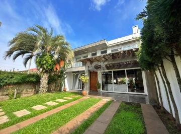 Casa · 338m² · 4 Quartos · 2 Vagas · Casa de alto padrão na Praia Grande em Torres/RS
