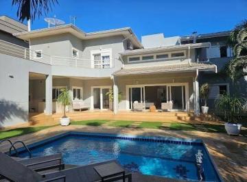 Casa · 392m² · 4 Quartos · 6 Vagas · Casa de alto padrão no Portal do Lago em Valinhos – 4 suítes, piscina aquecida e espaço gourmet