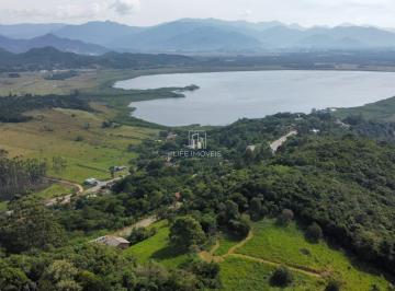 Foto 01 · Terreno 800m² à venda em Garopaba/SC no Condomínio Lagoa do Coração com vista pôr do sol