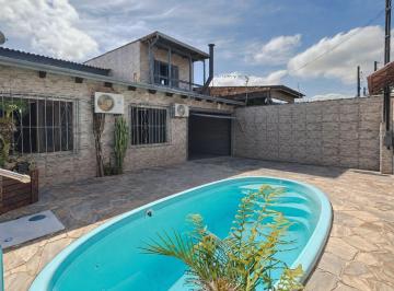 Photo 1 · Casa com piscina e com 4 dormitorios no bairro Restinga