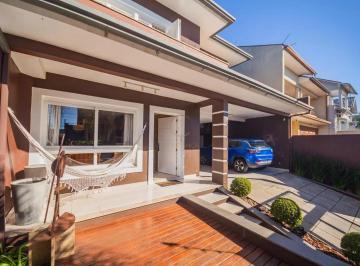 Casa · 200m² · 4 Quartos · 2 Vagas · Sobrado com 200m2 e lareira à venda em Canoas, no Estância Velha, loteamento Moinhos de Vento