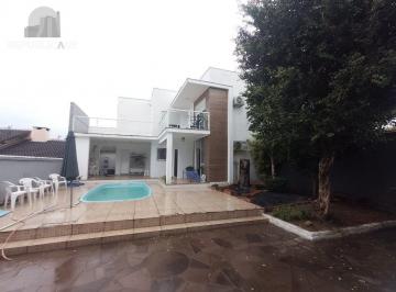 Casa · 328m² · 5 Quartos · 4 Vagas · Casa de 5 dormitórios, piscina e 4 vagas de garagem em Canoas.
