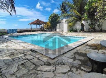 c1d0f7a8a762e0aaaae31fae6c65c7a7317871ec · Casa beira mar de 300m² à venda, com 4 quartos (2 suítes), localizada em Ponta de Pedras, Goiana - P