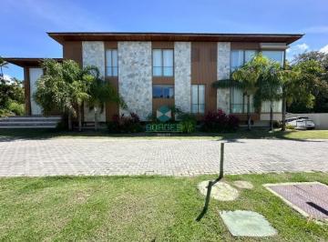 Foto 01 · Casa à venda com 375m², 5 suítes e arquitetura assinada no Condomínio Praia Bella - Praia do Forte, 