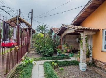 Casa · 230m² · 3 Quartos · 3 Vagas · Casa de 3 dormitórios , com suíte , banheiro social , 2 apartamentos de 1 dormitório nos fundos ,vag