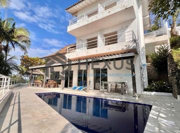 Foto · Casa frente mar com piscina e área gourmet no Condomínio Península na Praia da E