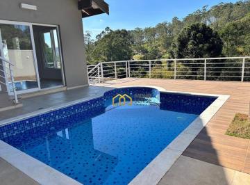 cdf84d14e3aacc278fe02458fd6983bcc6735a9a · Casa Moderna em Condomínio Fechado | Piscina, Espaço Gourmet e Vista para a Natureza