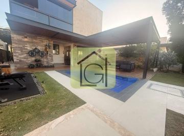 Casa · 308m² · 4 Quartos · 2 Vagas · Casa moderna com 4 suítes, piscina, jacuzzi e área gourmet integrada