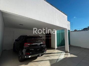 Fachada e garagem coberta p/ 2 carros · Casa à venda, 3 quartos, Bosque dos Buritis - Uberlândia/MG - Rotina Imobiliária