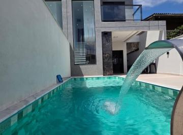 Foto 01 · Sobrado com piscina à venda em Itanhaém, 2 dormitórios, suíte e sacada a 950m da praia