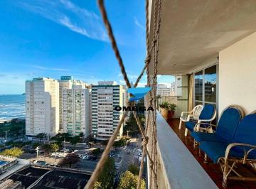 a1ea089b258f0c978ae7844f41c839221d053dae · Apartamento à venda na praia das Pitangueiras no Guarujá I Omega Imoveis