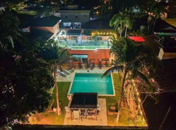 Foto · Casa moderna com 6 suítes e lazer no Balneário Praia de Pernambuco, Guarujá, SP