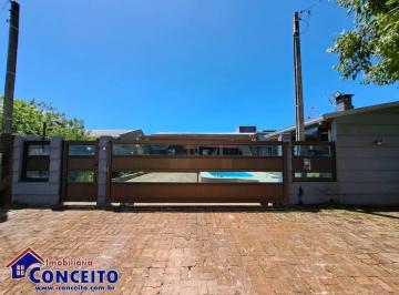 Casa de 4 quartos, Imbé · C705 - Belíssima residência com 04 dormitórios em excelente localização
