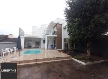 Casa · 328m² · 5 Quartos · 4 Vagas · Casa de 5 dormitórios, piscina e 4 vagas de garagem em Canoas.