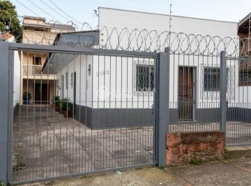 1 · CASA TÉRREA NA FRENTE, MAIS SOBRADO COM KITINESTES NO FUNDO DO TERRENO