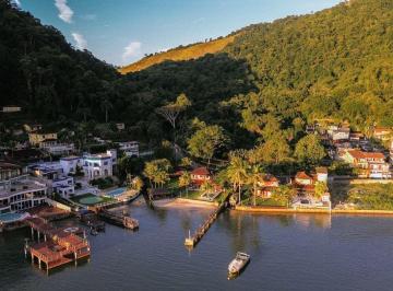 Casa · 450m² · 5 Quartos · 8 Vagas · Mansão Pé na Areia no Retiro: 5 Suítes, Píer Privativo e Vaga para Embarcação de até 60 Pés