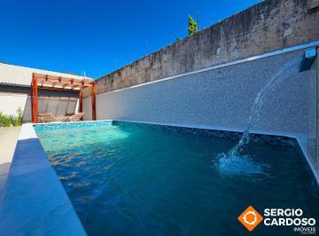 Casa · 118m² · 3 Quartos · 5 Vagas · CASA ALTO PADRÃO DE FRENTE PRO MAR! PISCINA PERGOLADO E ESPAÇO GOURMET!
