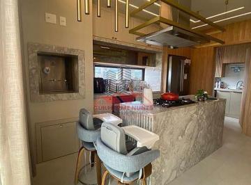 Cozinha gourmet de alto padrão totalmente equipada. Espaço moderno com bancada em granito nobre, eletrodomésticos embutidos, coifa em inox e churrasqueira integrada com sistema anti-fumaça para os seus momentos de lazer. · Apartamento Frente Mar em Porto Belo SC | Perequê 60x