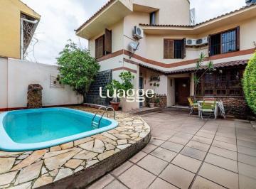Casa · 199m² · 3 Quartos · 3 Vagas · Casa com 3 suítes, 4 vagas e pátio com piscina no Bairro Boa Vista