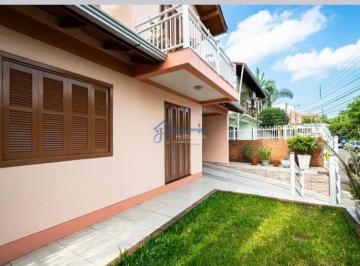 Casa · 317m² · 4 Quartos · 2 Vagas · Casa à venda em Novo Hamburgo com quintal, churrasqueira e suíte no bairro Rondônia