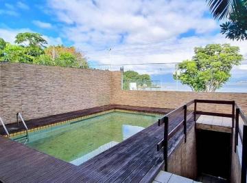 e77b785ba1df9f59fc58a49015dda66de51e10ad · Venda | Casa frente mar com 3 suítes, piscina, 550 m² e Espaço de Lazer - no Bom Abrigo