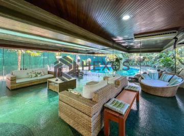 Foto · Casa térrea moderna com piscina e jardim, no Balneário Pernambuco, Guarujá