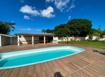 Foto 1 · Chácara à venda em Mongaguá com 2.100m², 2 casas, piscina e área de lazer completa