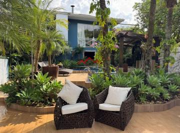 Foto 01 · Casa térrea, contemporânea e integrada à natureza, à venda no Portal do Paraíso 2