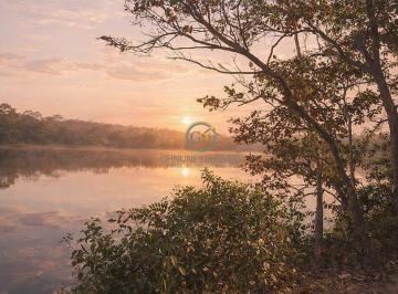 Pôr do sol às margens do Lago Cana Brava: um privilégio natural da propriedade que combina lazer, pesca e valorização imobiliária. · Fazenda 187 Alqueires à Venda em Minaçu-GO | Lago Cana Brava