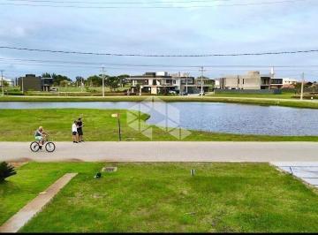 Terreno · 250m² · Lote frente lago no Condomínio Sunset em Xangri-lá