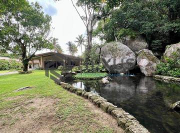 Foto · Casa com lago área gourmet e piscina no Jardim Guaiuba, Guarujá