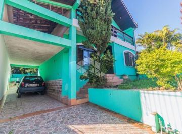 Casa · 267m² · 5 Quartos · 6 Vagas · CASA 5 DORMITÓRIOS COM EDÍCULA E 6 VAGAS À VENDA EM PORTO ALEGRE por R$999mil