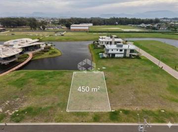 Terreno · 450m² · Lote com 450m² de frente para o clube no condomínio fechado Lótus em Atlântida