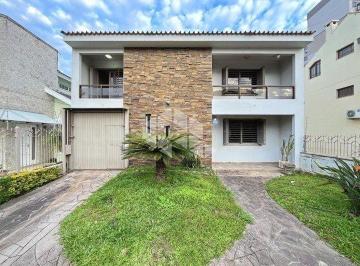 Casa · 385m² · 5 Quartos · 3 Vagas · Luxo e conforto na Zona Sul: Espetacular casa com 5 quartos, piscina e adega no Bairro Camaquã
