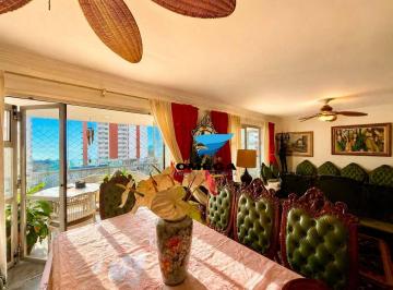 12894fc82c20cfff9e89c16f4cd04080f89f0be8 · Apartamento à venda na praia das Pitangueiras no Guarujá I Omega Imoveis