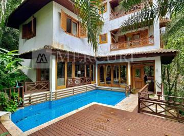 casa a venda no guarujá no condomínio granville, anunciada por imobiliárias em guarujá especializadas em imóveis exclusivos. · Casa de Alto Padrão no Guarujá, Condomínio Fechado, 5 Suítes e Vista Panorâmica para a Mata - Mercur