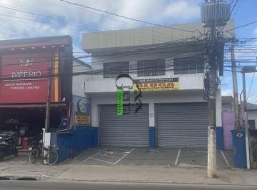 r124813-2.jpeg · Prédio na avenida em frente a Rodoviária