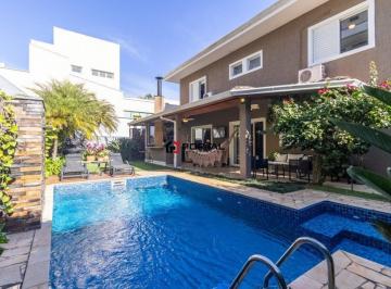 Casa · 328m² · 4 Quartos · 4 Vagas · Casa no condomínio Golf Village para venda com 4 quartos, sendo 4 suítes, 328m²!
