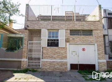 casa-fachada · CASA A VENDA NA OLAVO BILAC, 3 DORMITÓRIOS.